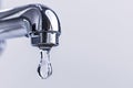 Close up of large drop of water coming out of water tap with copy sapce Royalty Free Stock Photo