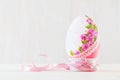 Single easter egg on wooden table. Decoupage art Royalty Free Stock Photo
