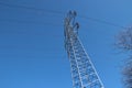 Single Electricity pylon and lines against the blue sky.