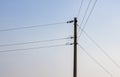 Single electricity transmission pole under the evening sky with copy space