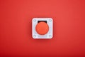 Single emergency button at the red background Royalty Free Stock Photo