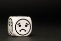 Single emoticon dice with sad expression sketch
