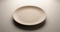 Minimalist Beige Plate on Textured Surface Royalty Free Stock Photo