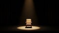 Single empty chair illuminated by a spotlight in a dark room image photo Royalty Free Stock Photo