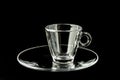 Single empty glass coffee cup on black background