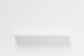 Single, empty white shelf board on white wall, object or product presentation template