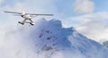 Single Engine Seaplane Flying over the Rocky Mountain Landscape. Royalty Free Stock Photo