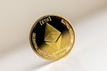 Single ethereum coin on the surface cryptocurrency