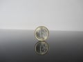 Single Euro coins on grey background Royalty Free Stock Photo