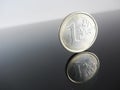 Single Euro coins on grey background Royalty Free Stock Photo