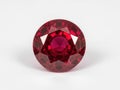 A single, faceted, deep red ruby gemstone Royalty Free Stock Photo