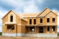 A single family home under construction the house has been framed and covered in plywood Royalty Free Stock Photo