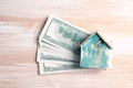 Single family house on pile of money Royalty Free Stock Photo