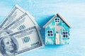 Single family house on pile of money Royalty Free Stock Photo