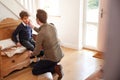 Single Father At Home Getting Son Wearing Uniform Ready For First Day Of School Royalty Free Stock Photo