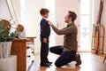 Single Father At Home Getting Son Wearing Uniform Ready For First Day Of School Royalty Free Stock Photo