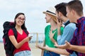 SIngle female backpacker on world trip talking with tourists