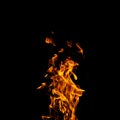Single fire flame on black background