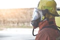 Single fireman in fire fighting protection suit