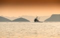 Single fishing boat heads out to sea. Adriatic, Croatia. Royalty Free Stock Photo