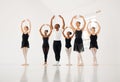 That single fleeting moment when you feel alive. a group of ballet dancers practicing a routine in a dance studio.