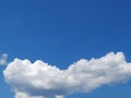 Single white cloud on bright blue sky Royalty Free Stock Photo