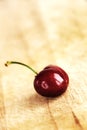 A single fresh cherry, small depth of field Royalty Free Stock Photo