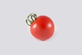 A single cherry tomato on a white background. Close-up photo Royalty Free Stock Photo