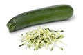 Single fresh green whole zucchini and noodles on white background Royalty Free Stock Photo