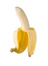 Single fresh, yellow, ripe banana half peeled