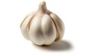 a garlic bulb is sitting on the table, with its bulb still attached