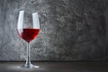 Single glass of red wine for tasting in dark cellar with copy space Royalty Free Stock Photo