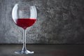 Single glass of red wine for tasting in dark cellar with copy space Royalty Free Stock Photo