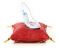 Single glass shoe standing on red velvet cushion. 3D illustration Royalty Free Stock Photo