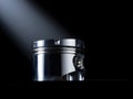 Polished metal piston on a dark background with dramatic spotlight illumination Royalty Free Stock Photo