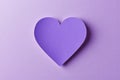 Single glittering purple heart shape on a soft purple background Royalty Free Stock Photo