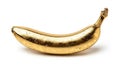 Single Glossy Gold Metallic Banana with Reflective Surface Isolated on White Background Royalty Free Stock Photo