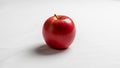A single glossy red apple is centered on a plain white background Royalty Free Stock Photo
