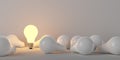 Single glowing light bulb standing in group of light bulbs, inspiration, leader, leadership or thinking creative concept Royalty Free Stock Photo