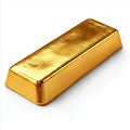 A single gold bar gleaming on a white surface casting a subtle shadow in a studio environment Royalty Free Stock Photo
