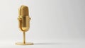 A single gold microphone against a plain white backdrop , simple, isolated, background Royalty Free Stock Photo