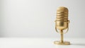 A single gold microphone against a plain white backdrop , simple, microphone, studio Royalty Free Stock Photo