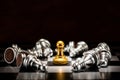 Single gold pawn chess surrounded by a number of fallen silver c Royalty Free Stock Photo