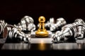 Single gold pawn chess surrounded by a number of fallen silver c Royalty Free Stock Photo