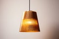 single gold pendant lamp against a white ceiling
