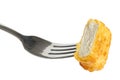 Single golden deep-fried battered chicken nugget on a fork isola