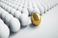 Single golden Egg in a  large Group of white Eggs Royalty Free Stock Photo