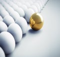 Single golden Egg in a  large Group of white Eggs Royalty Free Stock Photo