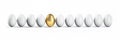 Single golden Egg in a  Row of white Eggs Royalty Free Stock Photo