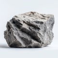 A single gray stone block on a white surface with rough texture Royalty Free Stock Photo